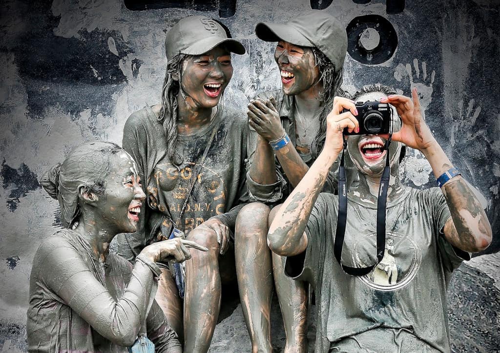 Participating in the Boryeong Mud Festival